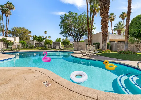 a view of a swimming pool with a yard
