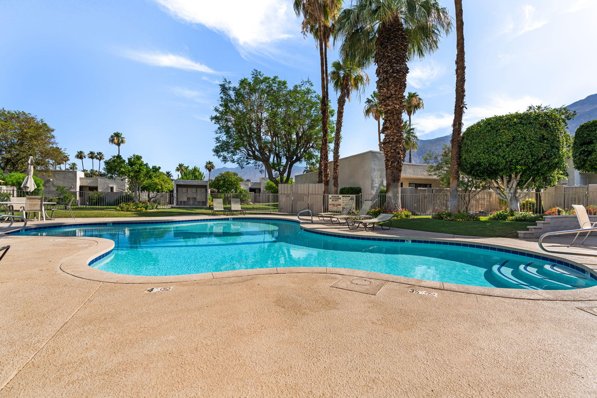 877 East Arenas Road Palm Springs, CA 92262 - Photo 40 of 43 a view of a swimming pool with a yard