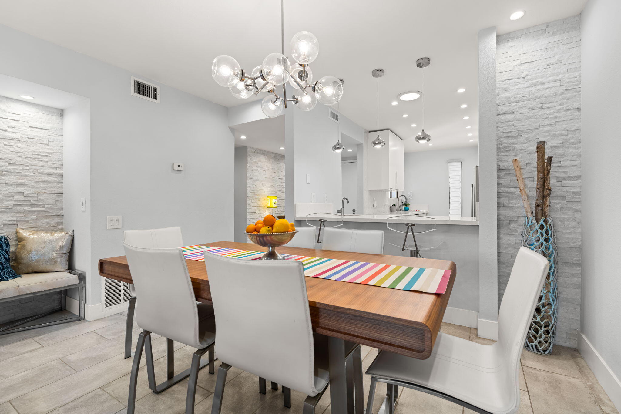 877 East Arenas Road Palm Springs, CA 92262 - Photo 4 of 43 a view of a dining room with furniture and wooden floor