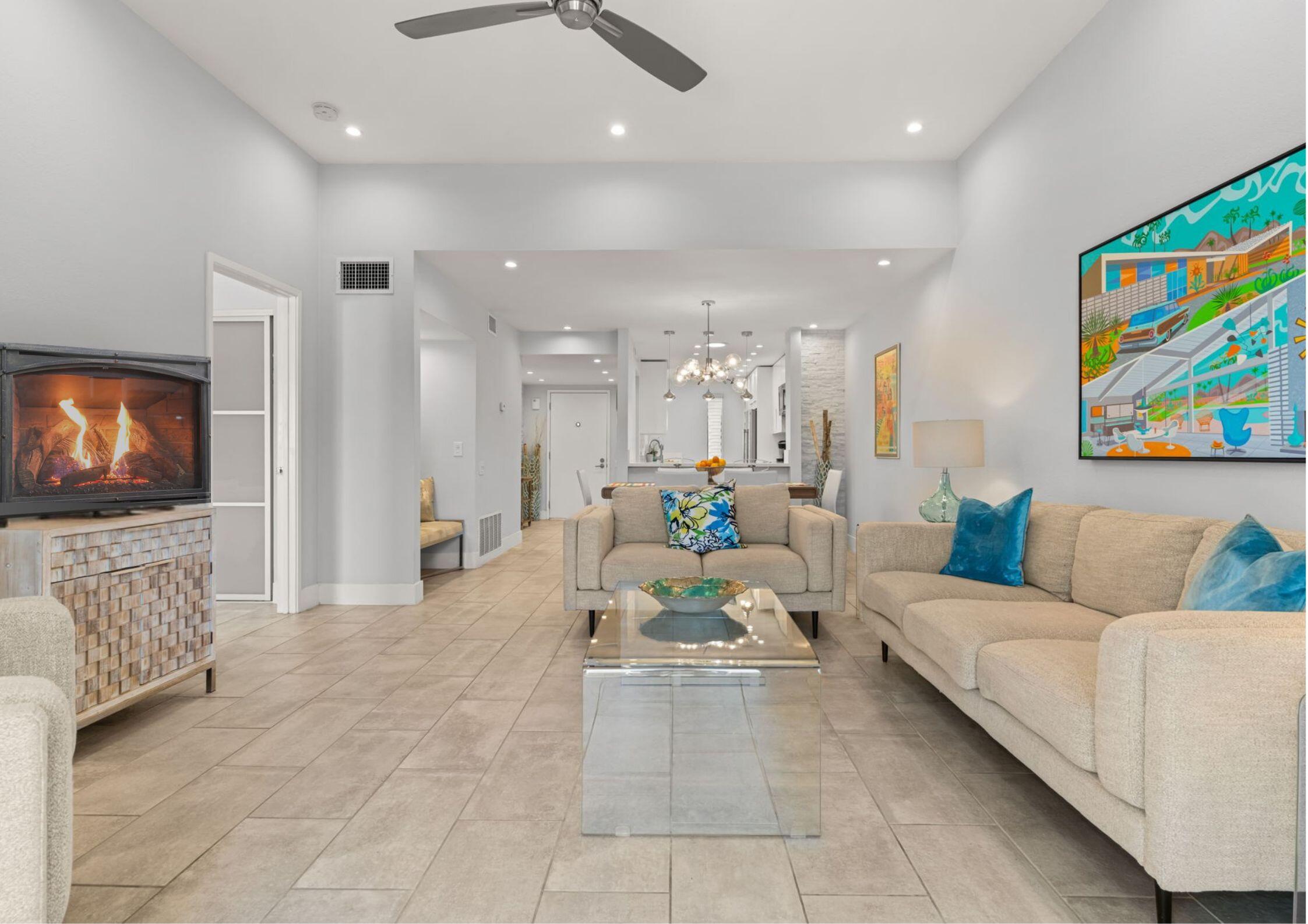 877 East Arenas Road Palm Springs, CA 92262 - Photo 7 of 43 a living room with furniture and a flat screen tv