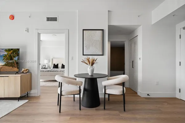 a living room with furniture and a table
