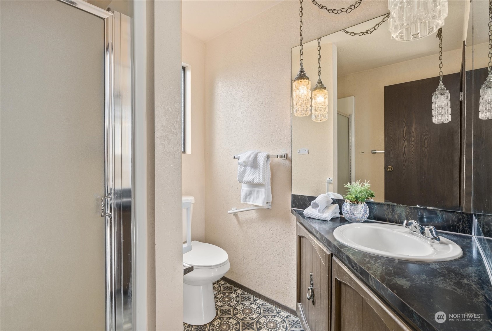 9623 Northeast 204th Place Bothell, WA 98011 - Photo 12 of 26 a bathroom with a granite countertop sink toilet and shower