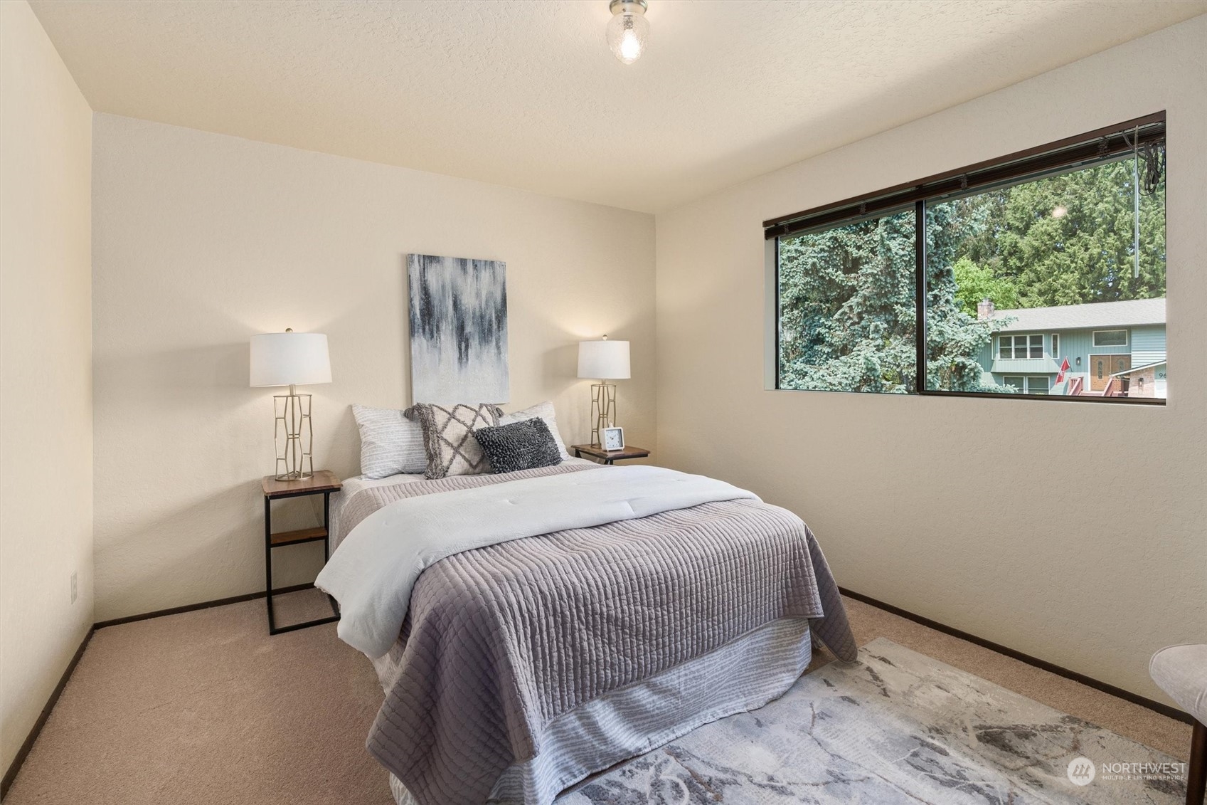 9623 Northeast 204th Place Bothell, WA 98011 - Photo 14 of 26 a bedroom with a bed and a window
