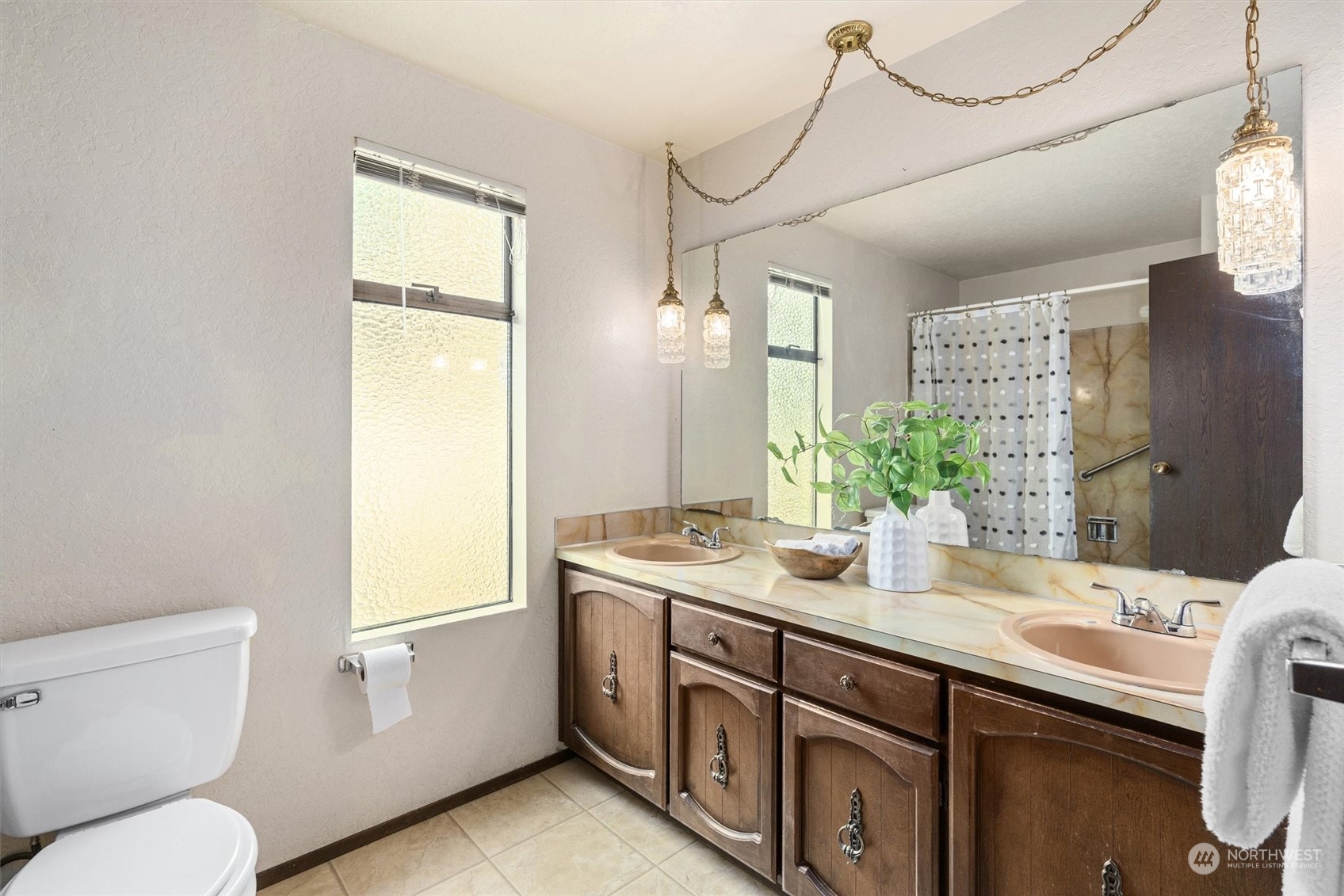 9623 Northeast 204th Place Bothell, WA 98011 - Photo 15 of 26 a bathroom with a granite countertop sink toilet and mirror