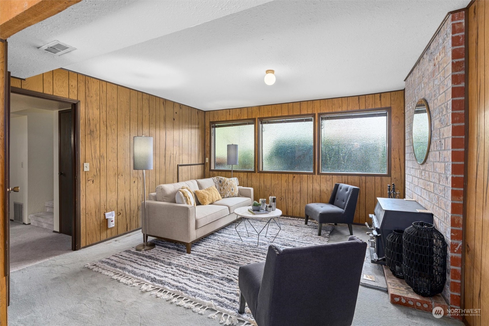 9623 Northeast 204th Place Bothell, WA 98011 - Photo 17 of 26 a living room with furniture and a floor to ceiling window