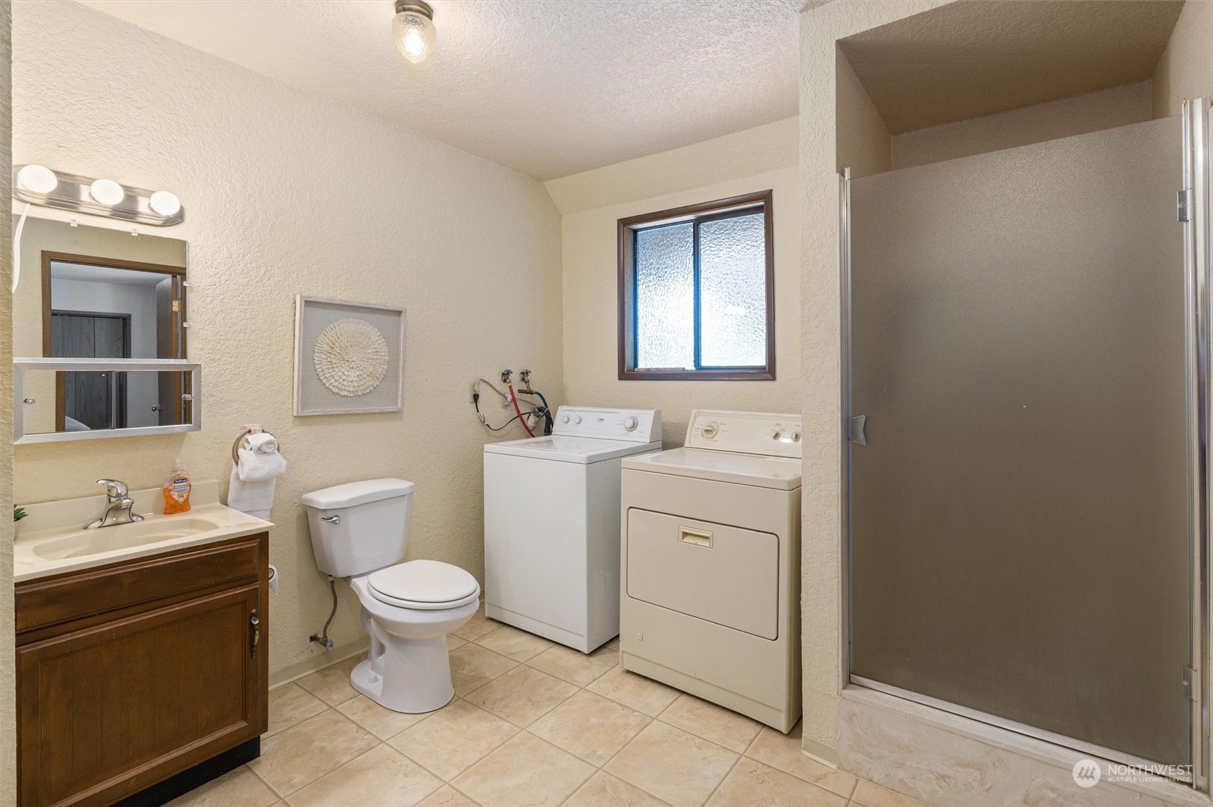 9623 Northeast 204th Place Bothell, WA 98011 - Photo 20 of 26 a bathroom with a toilet sink and mirror