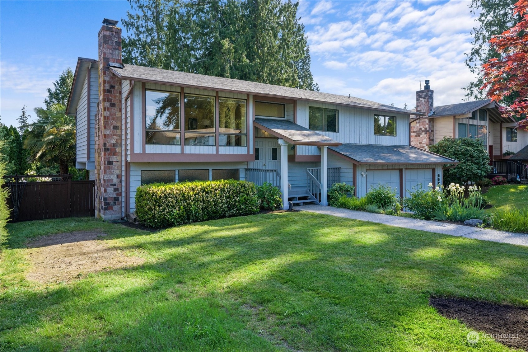 9623 Northeast 204th Place Bothell, WA 98011 - Photo 2 of 26 a front view of a house with a yard
