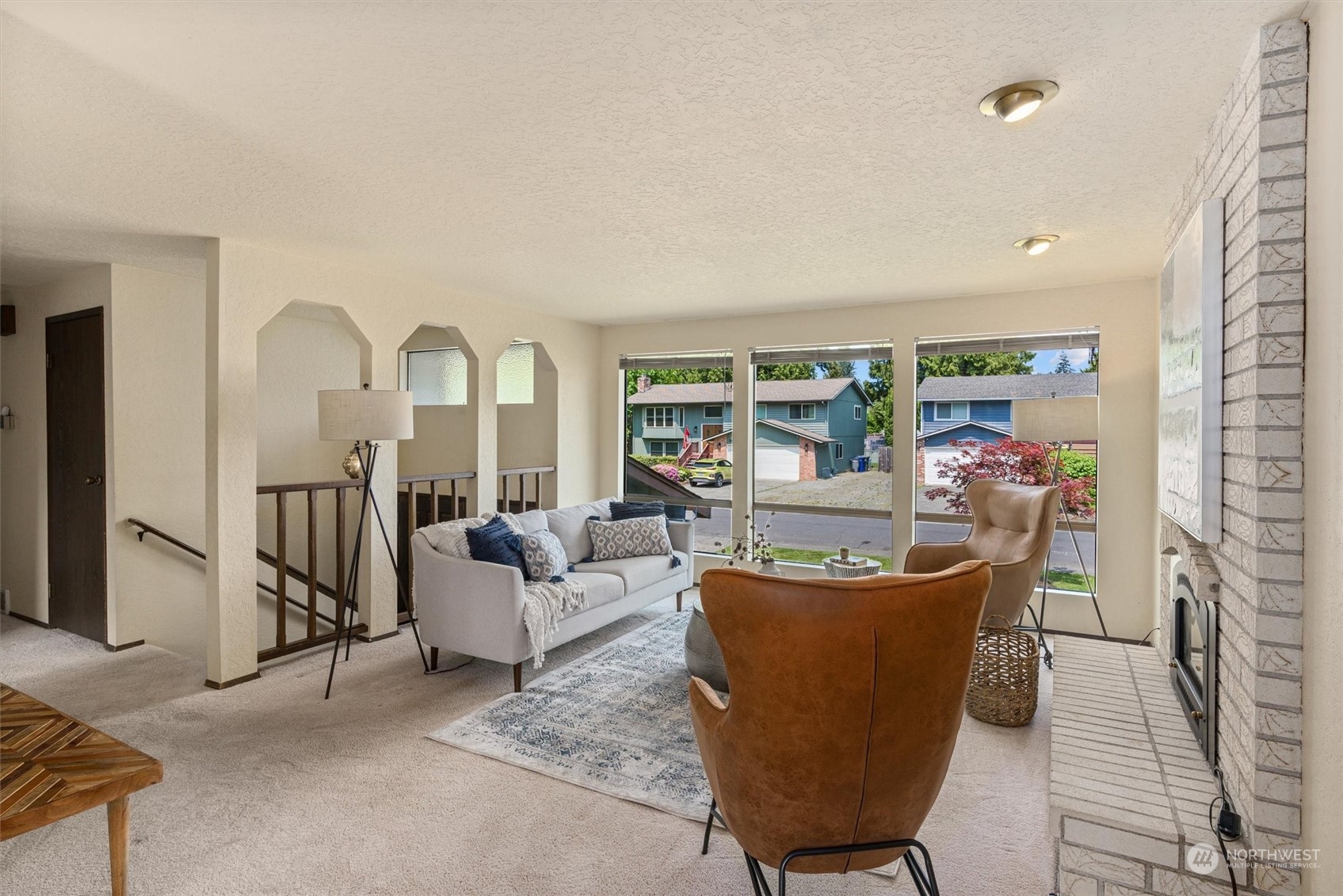 9623 Northeast 204th Place Bothell, WA 98011 - Photo 4 of 26 a living room with fireplace furniture and a large window