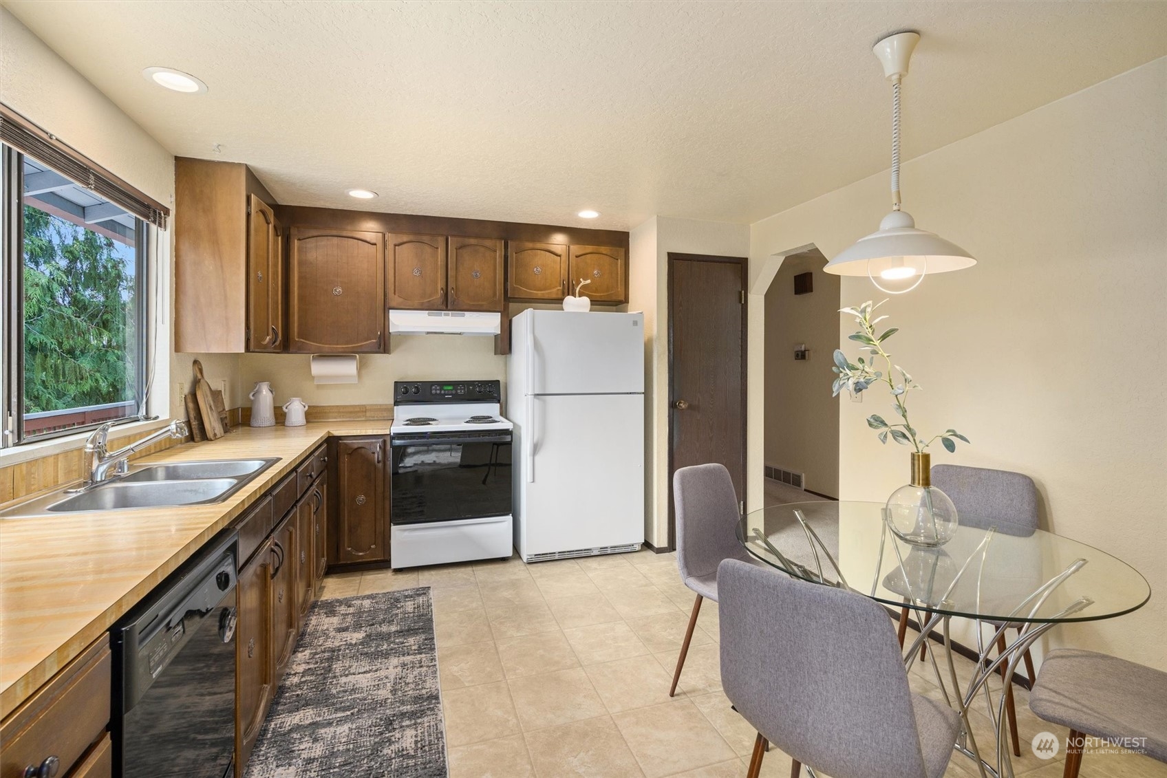 9623 Northeast 204th Place Bothell, WA 98011 - Photo 7 of 26 a kitchen with a sink appliances and cabinets