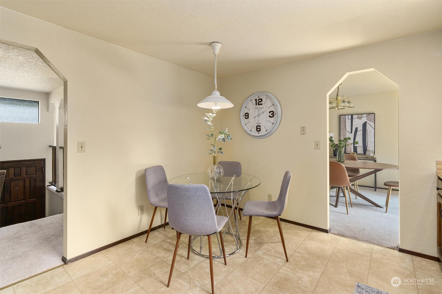 9623 Northeast 204th Place Bothell, WA 98011 - Photo 9 of 26 a view of a dining area with furniture and a large window