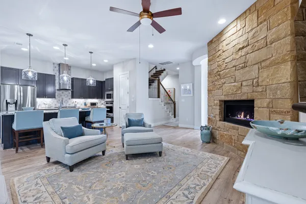 a living room with furniture and a fireplace