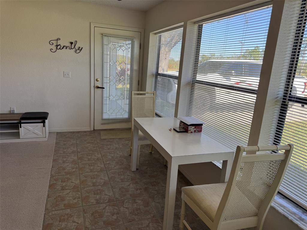 329 Genesis Pointe Drive, Unit 329 Lake Wales, FL 33859 - Photo 14 of 29 a living room with furniture and a window