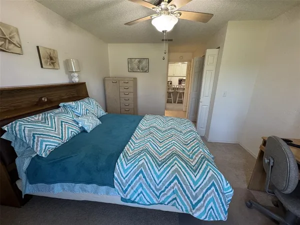 a bedroom with a bed and dresser