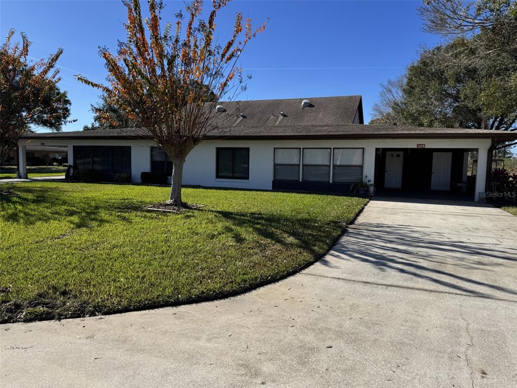 329 Genesis Pointe Drive, Unit 329 Lake Wales, FL 33859 - Photo 2 of 29 a view of a house with a garden