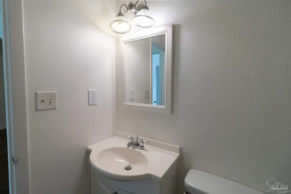 a bathroom with a sink and a toilet