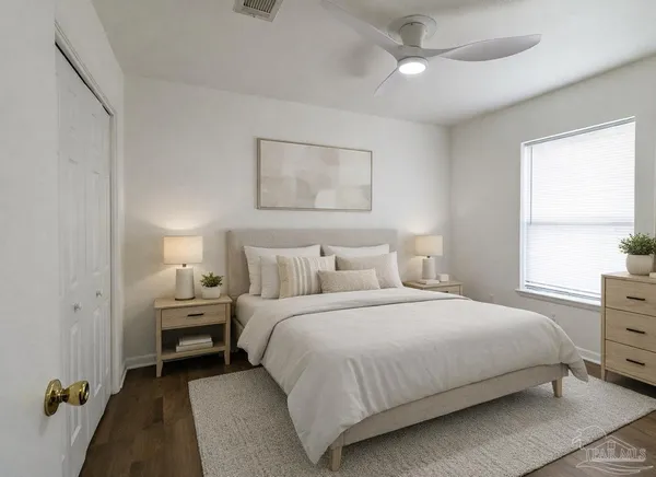 a bedroom with a bed and a window