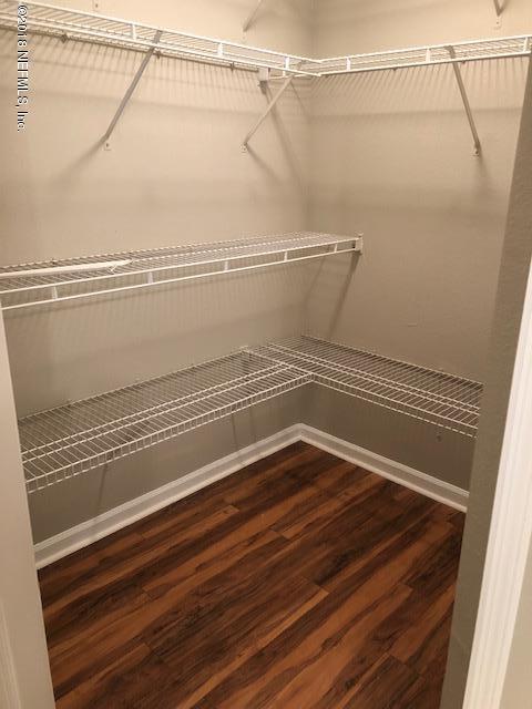 8550 Touchton Road, Unit 938 Jacksonville, FL 32216 - Photo 23 of 32 a view of a room with racks on the wall