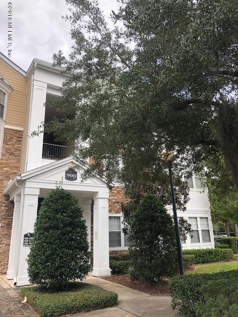 8550 Touchton Road, Unit 938 Jacksonville, FL 32216 - Photo 27 of 32 front view of a house with a yard