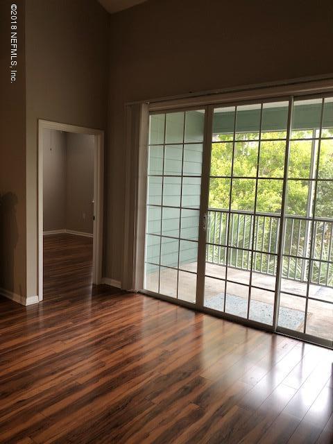 8550 Touchton Road, Unit 938 Jacksonville, FL 32216 - Photo 28 of 32 a view of empty room with wooden floor and fan
