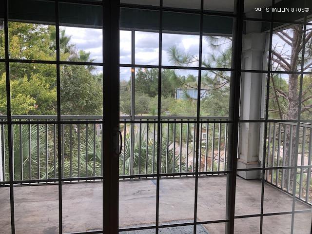 8550 Touchton Road, Unit 938 Jacksonville, FL 32216 - Photo 7 of 32 a view of outdoor space with a floor to ceiling window