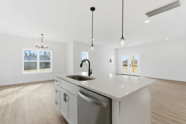 a kitchen with sink and window