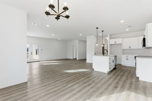 a view of kitchen with cabinets and wooden floor