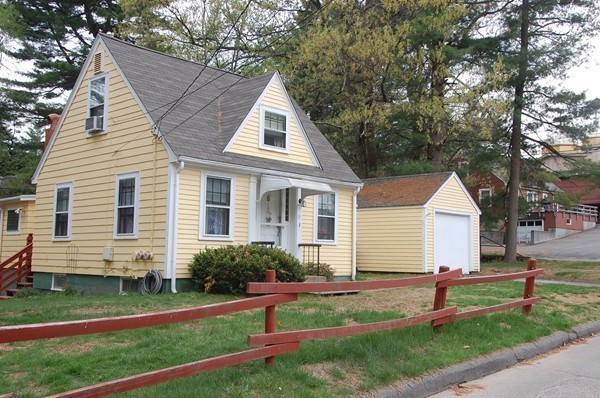 73 Wellesley Road Natick, MA 01760 - Photo 2 of 11 a front view of a house with a yard