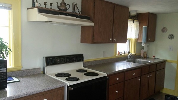 73 Wellesley Road Natick, MA 01760 - Photo 5 of 11 a kitchen with a sink and a cabinets