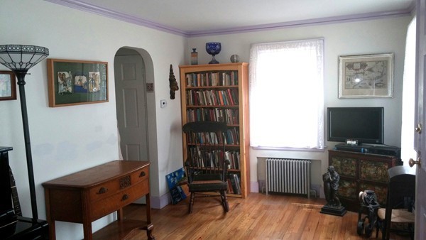 73 Wellesley Road Natick, MA 01760 - Photo 6 of 11 a view of a livingroom with furniture and a flat screen tv
