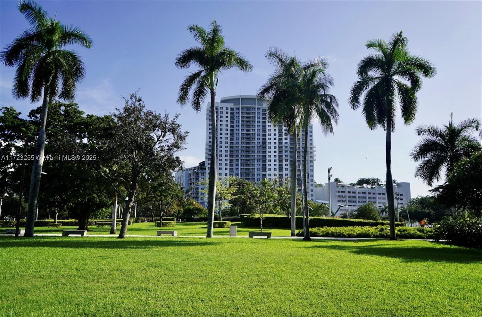 1830 Radius Drive, Unit 810 Hollywood, FL 33020 - Photo 18 of 26 a view of a park and palm trees