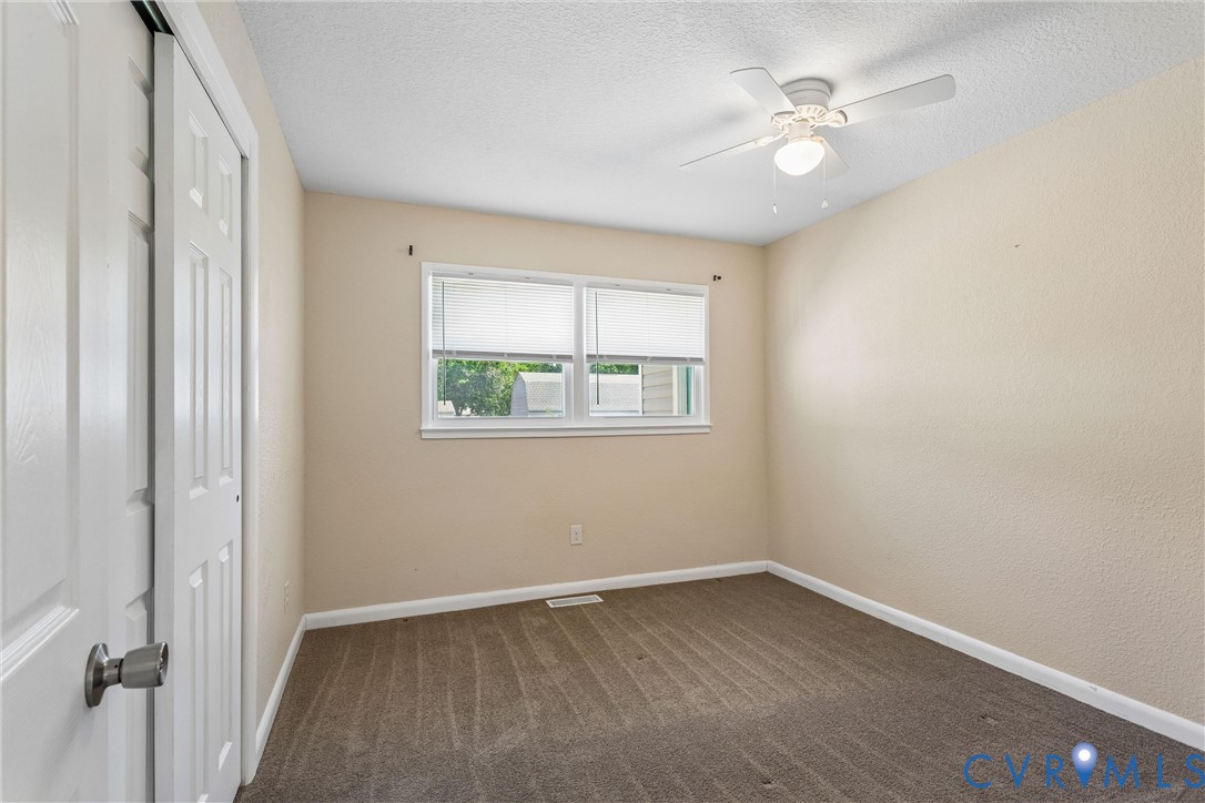 6 Barnes Court Hampton, VA 23664 - Photo 14 of 38 an empty room with windows and fan