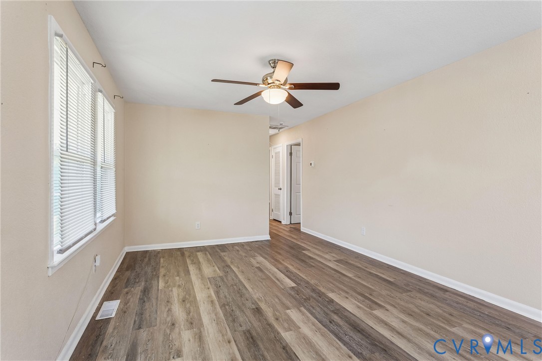 6 Barnes Court Hampton, VA 23664 - Photo 4 of 38 a view of empty room with wooden floor and fan