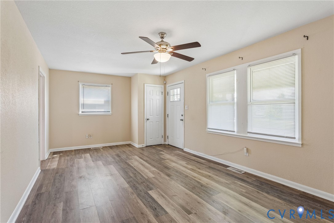 6 Barnes Court Hampton, VA 23664 - Photo 6 of 38 wooden floor in an empty room with a window