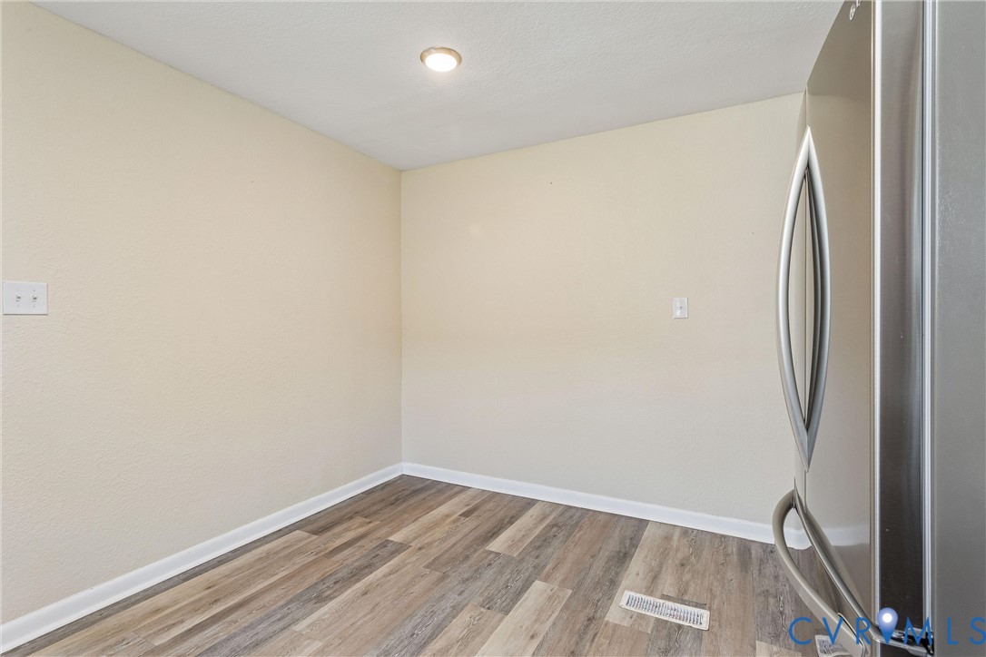 6 Barnes Court Hampton, VA 23664 - Photo 10 of 38 a view of a room with wooden floor and a window