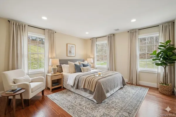 a bedroom with a bed and a couch