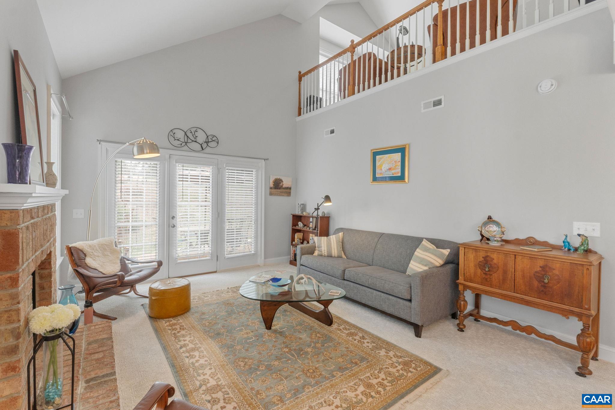 1313 Gate Post Lane Charlottesville, VA 22901 - Photo 11 of 44 a living room with furniture and a window