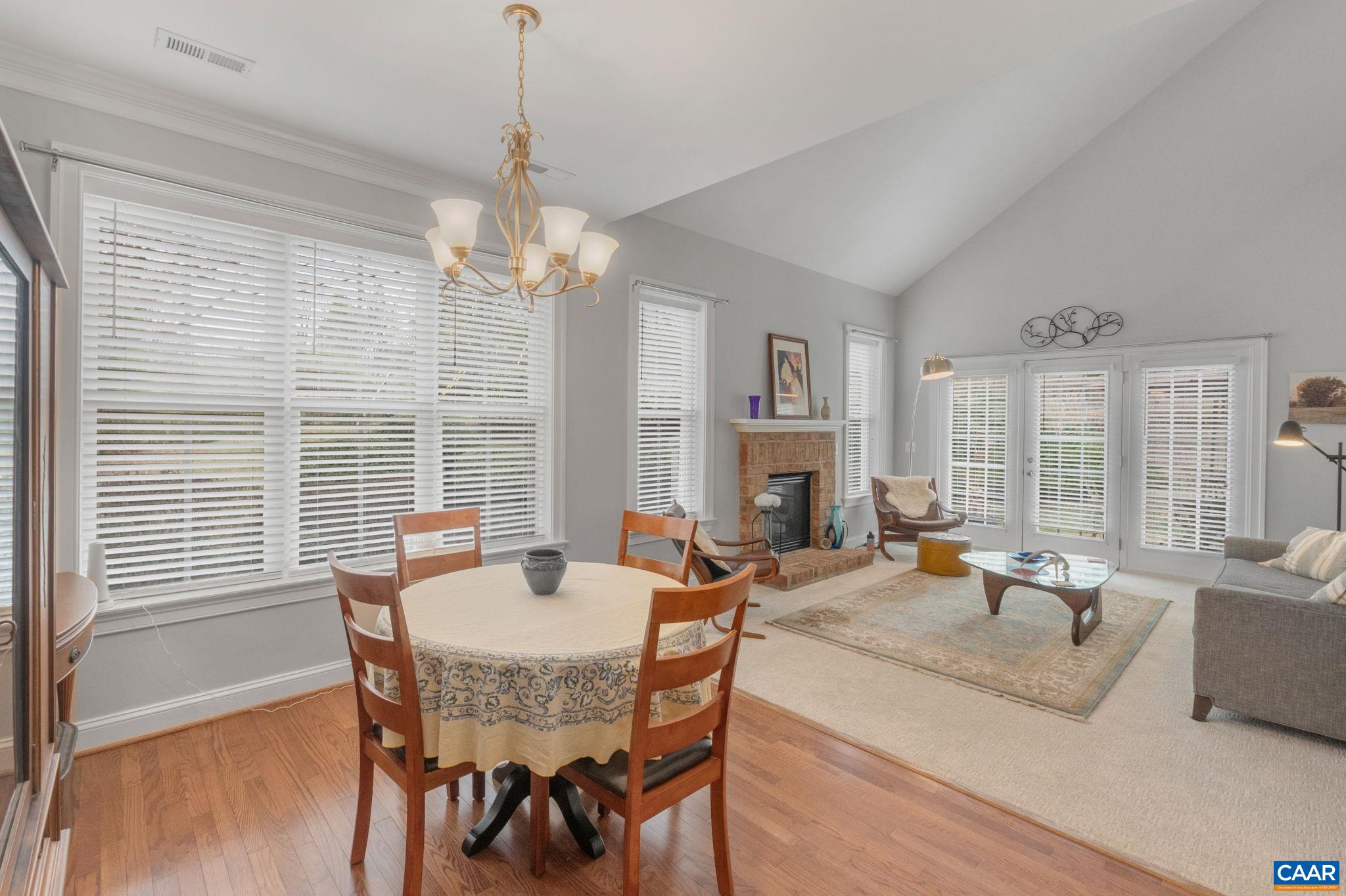 1313 Gate Post Lane Charlottesville, VA 22901 - Photo 21 of 44 a dining room with furniture a chandelier and wooden floor