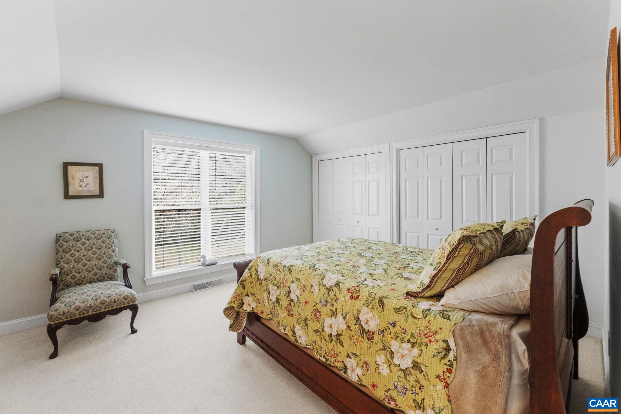 1313 Gate Post Lane Charlottesville, VA 22901 - Photo 29 of 44 a bedroom with a bed and a window