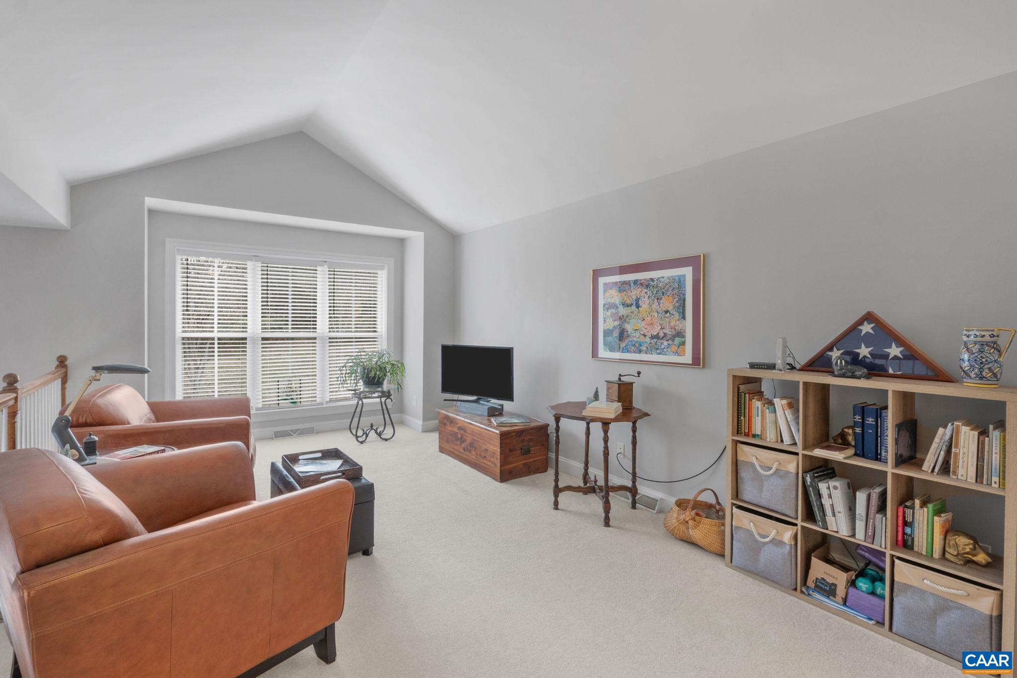 1313 Gate Post Lane Charlottesville, VA 22901 - Photo 32 of 44 a living room with furniture a rug and a window