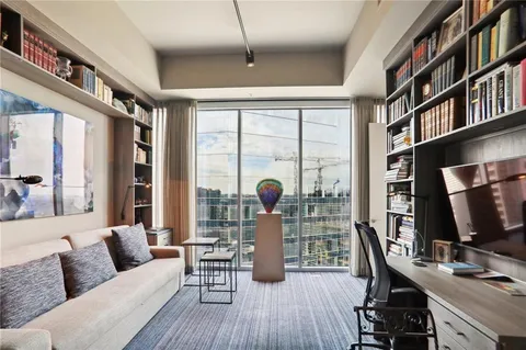 a living room with furniture fireplace and a flat screen tv