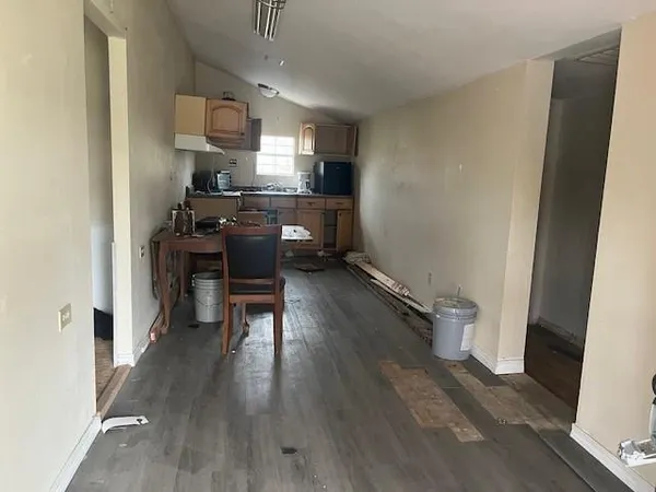 a kitchen with a sink appliances and cabinets