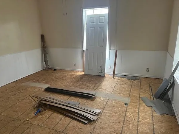 a kitchen with a sink appliances cabinets and a window