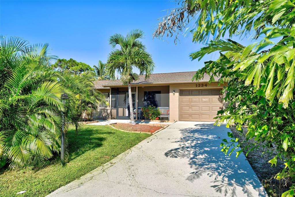 1234 Olympia Road Venice, FL 34293 - Photo 1 of 1 With the mature landscaping around the front, this home has tremendous curb appeal.