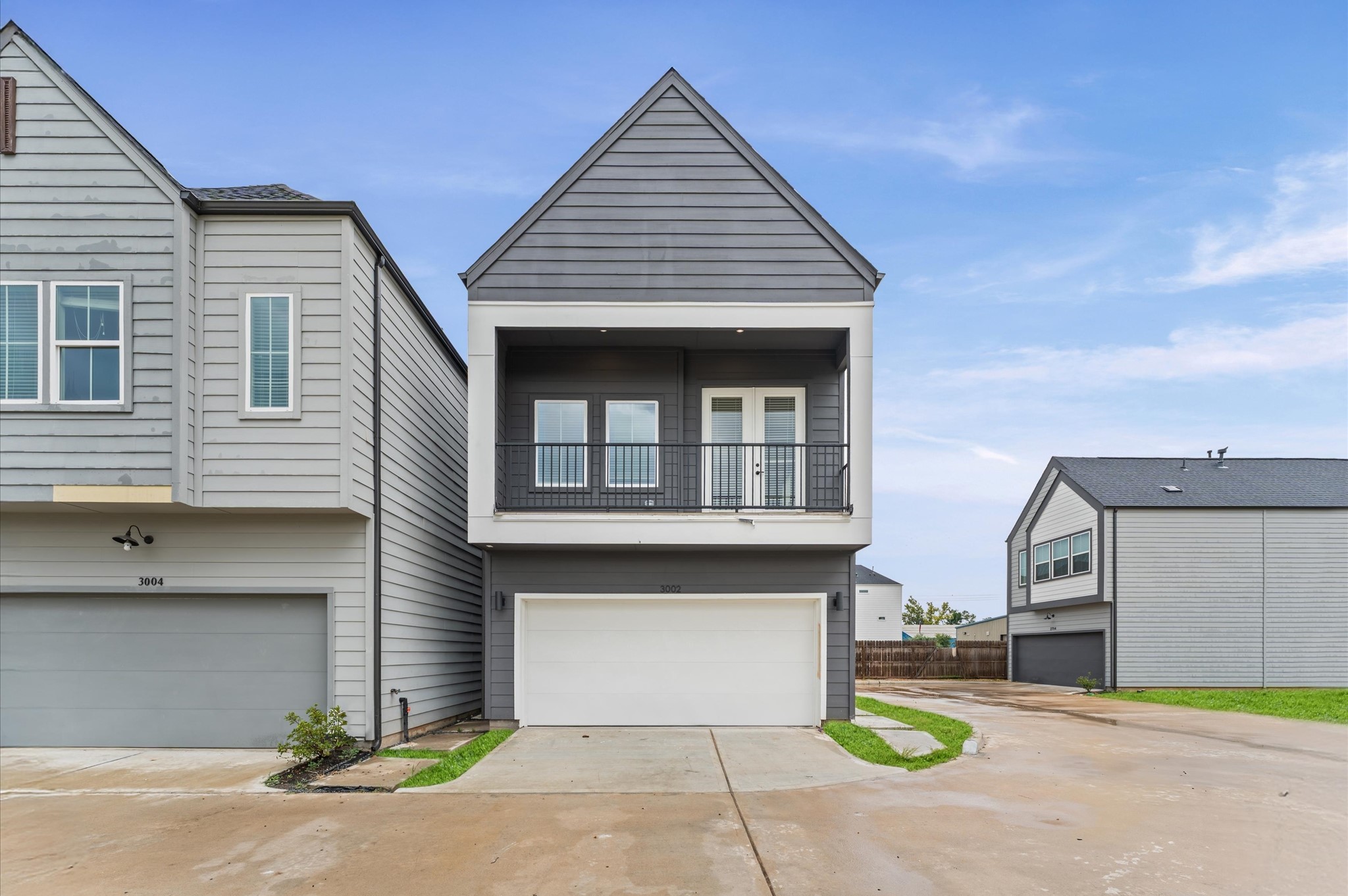 3002 Jensen Drive Houston, TX 77026 - Photo 5 of 42 a front view of a house with a garden and garage