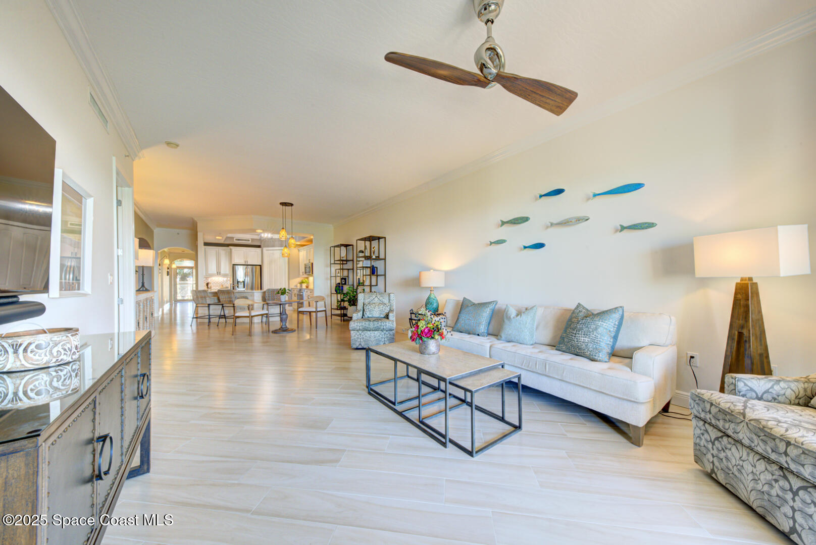 2022 Julep Drive, Unit 105 Cocoa Beach, FL 32931 - Photo 18 of 67 living room with fan (9)