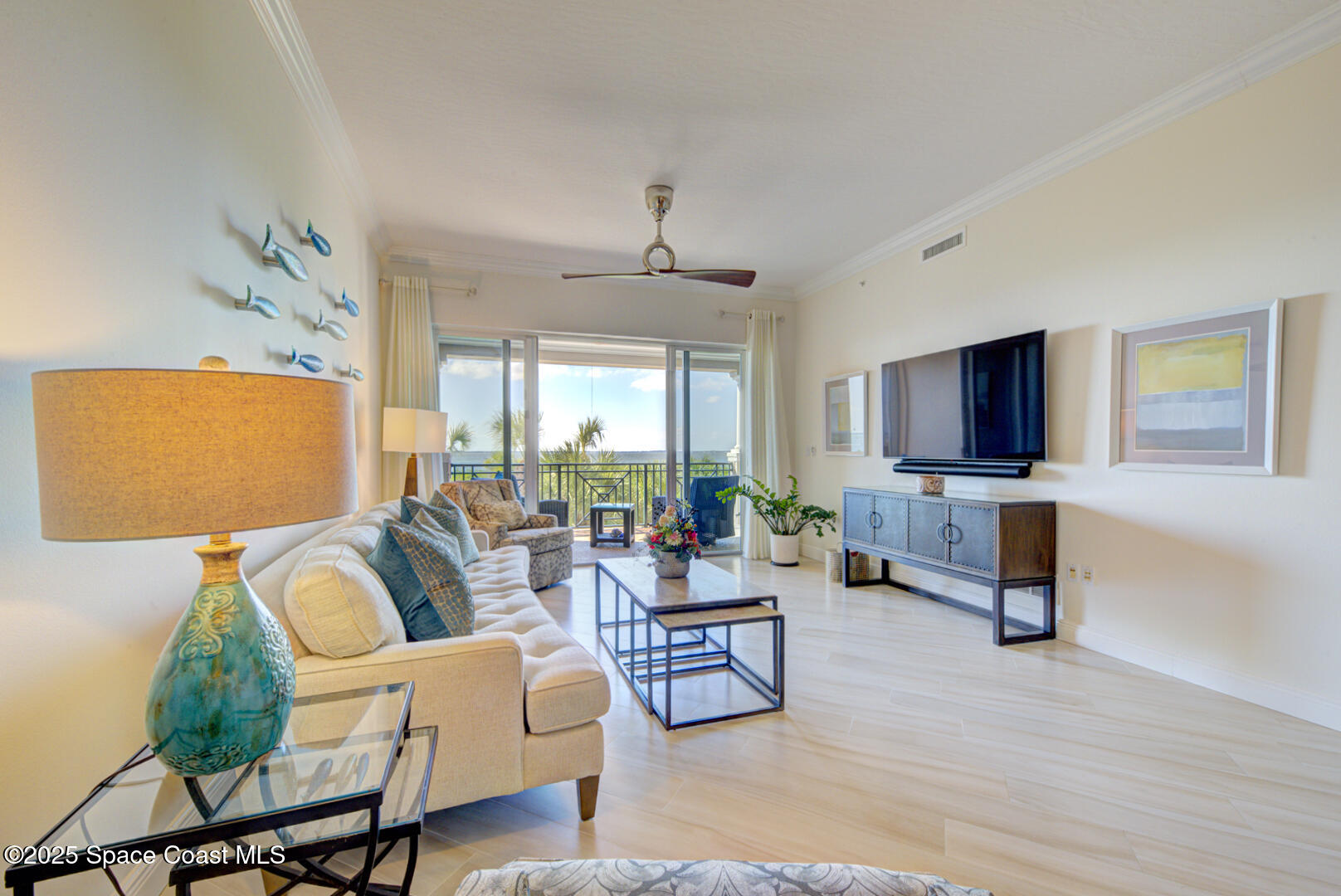 2022 Julep Drive, Unit 105 Cocoa Beach, FL 32931 - Photo 20 of 67 living room with slider to balcony (12)