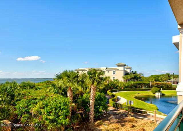 a bedroom with a bed chair and flat screen tv
