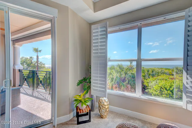 a en suite bathroom with a granite countertop sink and a mirror