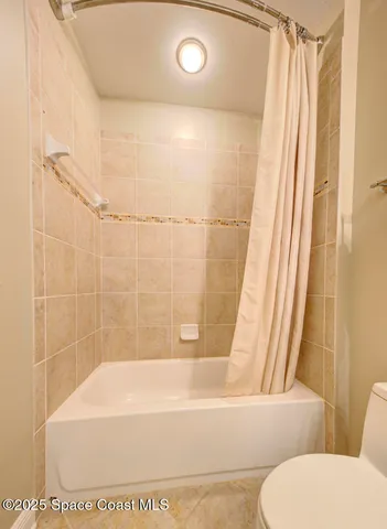 a view of a white house with a yard