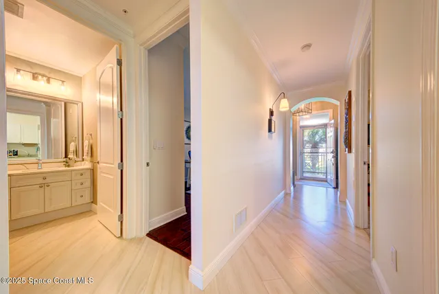 a large living room with stainless steel appliances granite countertop furniture a fireplace and a large window